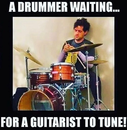 A drummer waiting for a guitarist to tune...